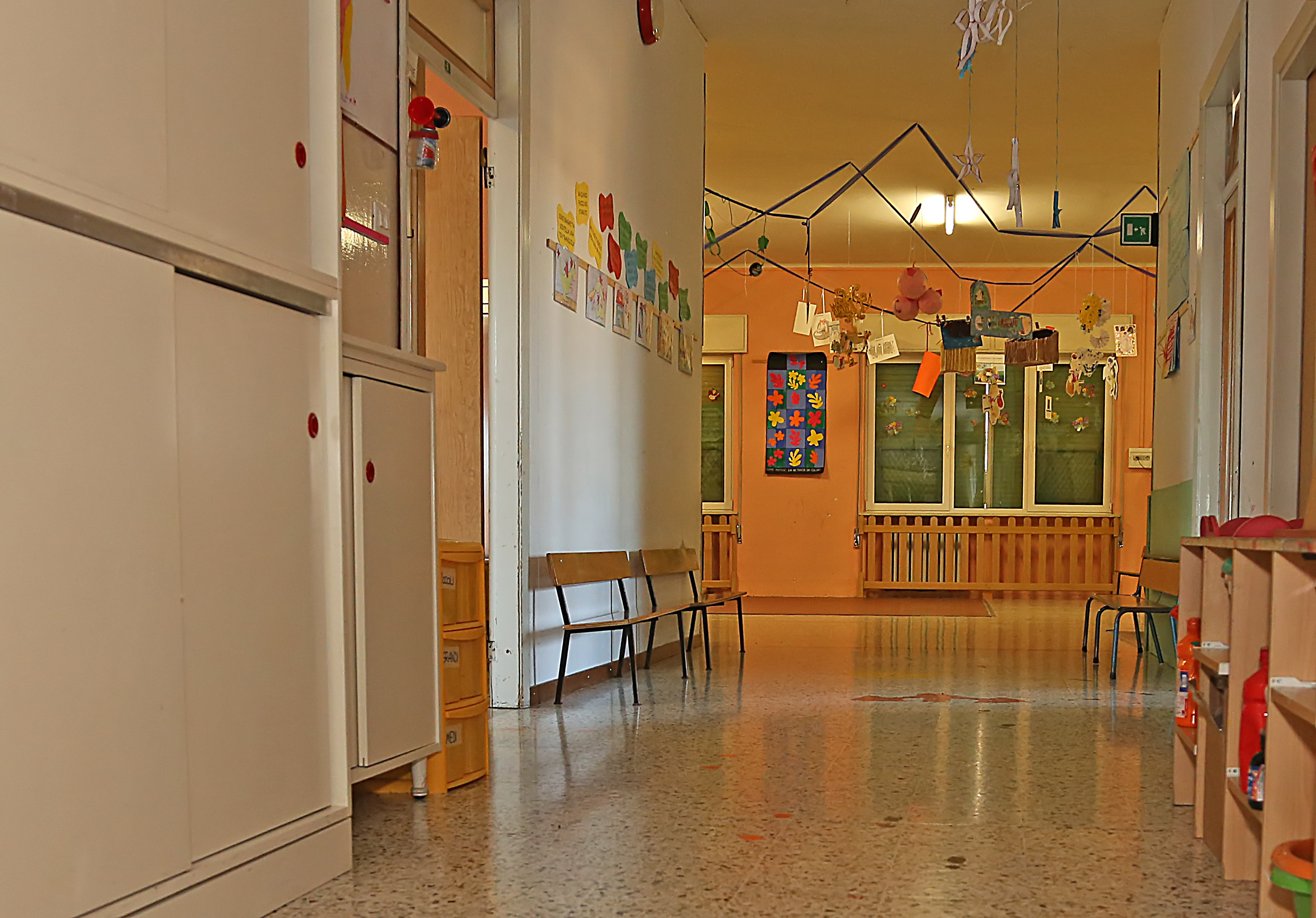 long corridor of a nursery with the decorations hung on walls
