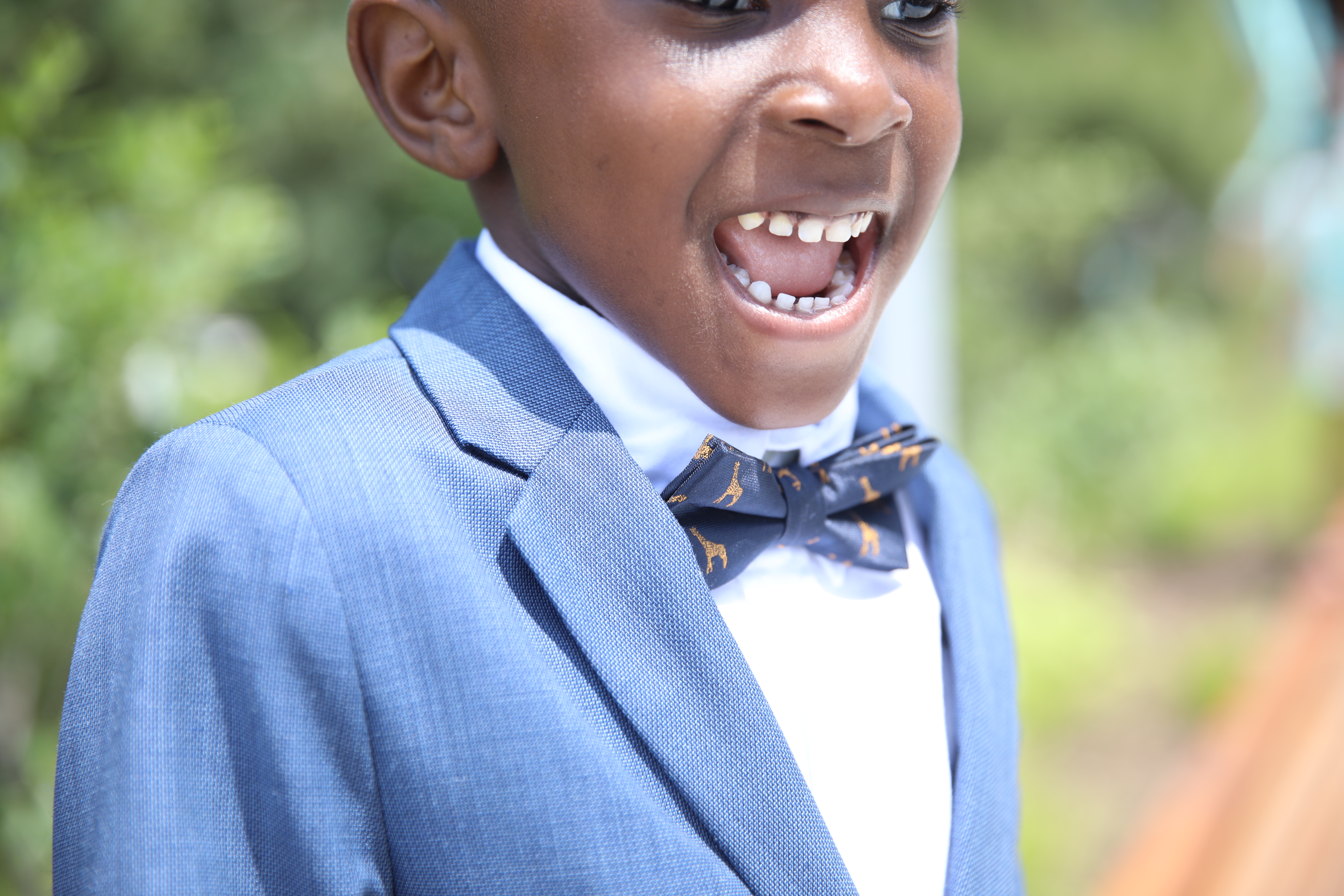 Dapper Style: Boys Suit with Leather Sneakers