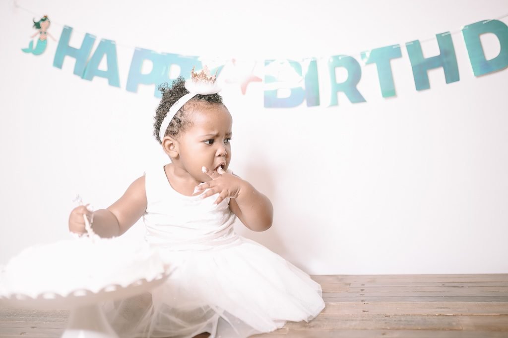 Edmonton, Alberta, Canada; A Baby Eating Birthday Cake With His Hands -  Stock Photo - Dissolve