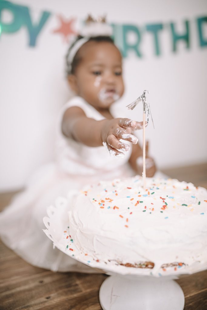 little girl eating cake