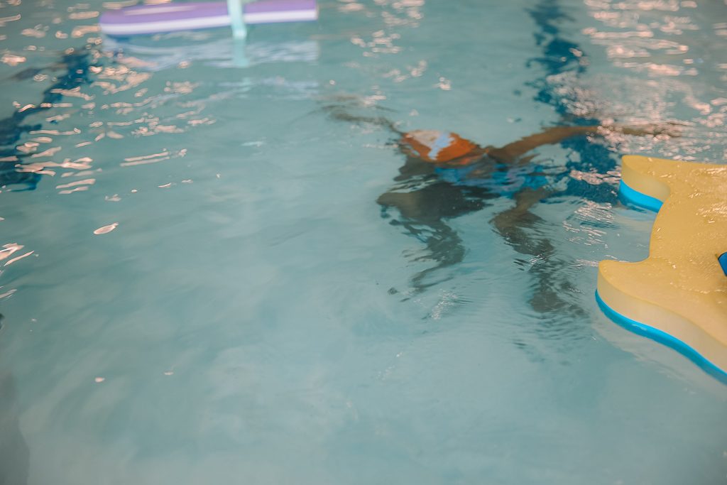 Kids swimming in the pool at Goldfish Swim School.